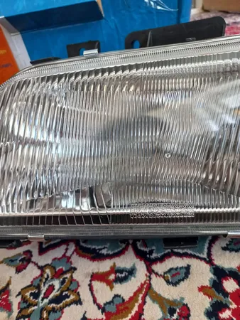 چراغ جلو خودرو SNT مدل JT123 مناسب برای پژو 405 بسته 2 عددی