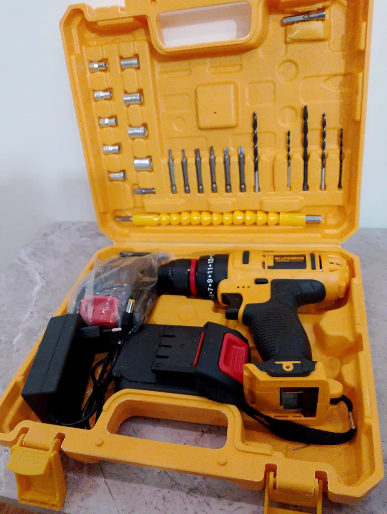 دریل پیچ گوشتی شارژی چکشی نیو پاور مدل 36-2 مجموعه 25 عددی