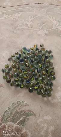 تیله شیشه ای مداد چوبی مدل چند پر بسته 100 عددی