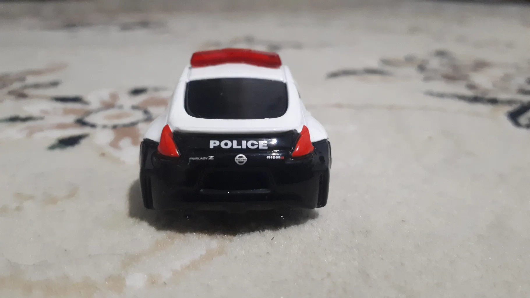 ماشین بازی تاکارا تامی مدل Nissan Fairlady Z Nismo Police Car کد 859963