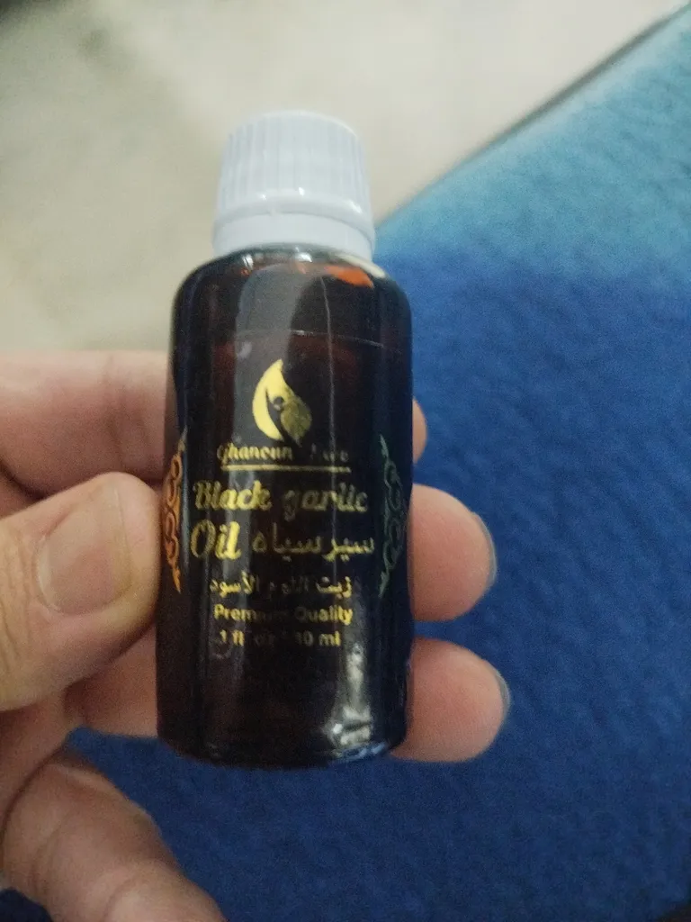 سرم مو قانون مدل سیر سیاه حجم 30 میلی لیتر