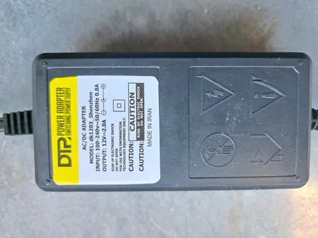 آداپتور 12 ولت 2 آمپر دی ای پی مدل dk1203_shenzhen