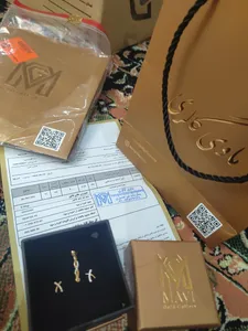 تجریه خرید گوشواره طلا 18 عیار زنانه ماوی گالری مدل ایکس ساده و نگین