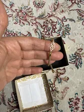 تجریه خرید دستبند طلا 18 عیار زنانه مدل قلب و بی نهايت