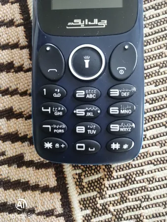 گوشی موبایل جی ال ایکس مدل f1702 دو سیم‌ کارت ظرفیت 32 مگابایت و رم 32 مگابایت