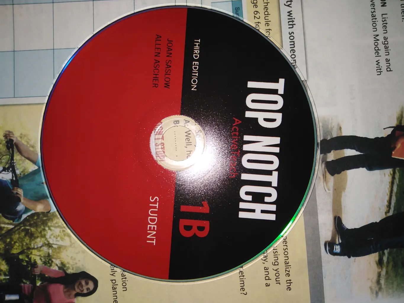 کتاب زبان تاپ ناچ 1B اثر Joan Saslow به همراه لوح فشرده