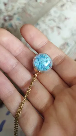 آویز گردنبند دخترانه مدل گوی شیشه ای پر ستاره کد AG 574