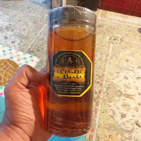 عسل ناب نصیری شرف - 1100 گرم