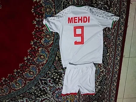 ست تی شرت آستین کوتاه و شلوارک ورزشی پسرانه طرح تیم ملی ایران مدل جام جهانی کد 2022