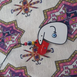 تجریه خرید آویز تزیینی خودرو طرح چشم نقولی