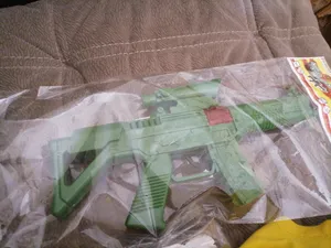 تجریه خرید تفنگ بازی گلدن گان مدل naabsell115