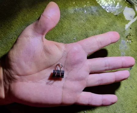 گیره کاغذ دینگ لی مدل DL.0006 سایز 15 میلی متر بسته 12 عددی