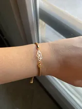 تجریه خرید دستبند طلا 18 عیار زنانه مدل قلب و بی نهايت