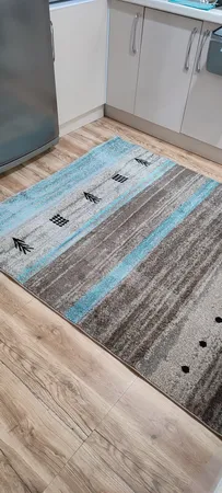 فرش ماشینی ساوین کد ۴۰۰۲ زمینه شکلاتی