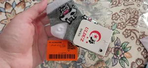 تجریه خرید جوراب نوزادی طرح گاو