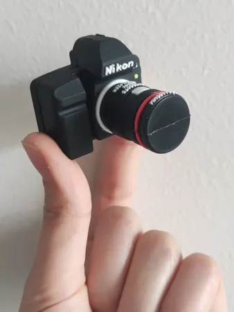 فلش مموری طرح دوربین عکاسی نیکون مدل Ul-CN02 ظرفیت 32 گیگابایت