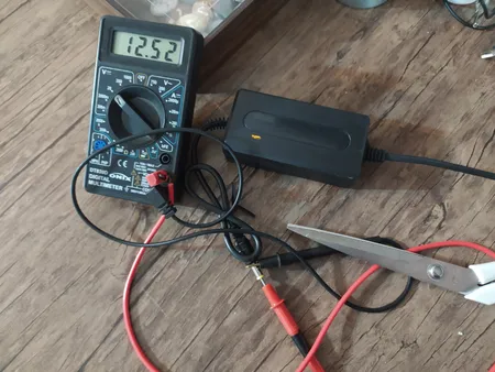 آداپتور 12 ولت 2 آمپر دی ای پی مدل dk1203_shenzhen