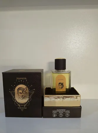 ادو پرفیوم مردانه مومیا مدل تام ولف کهربا با رایحه تلخ و گرم حجم 50 میلی لیتر