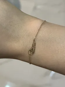 تجریه خرید دستبند زنجیری طلا 18 عیار زنانه الی گالری مدل بال