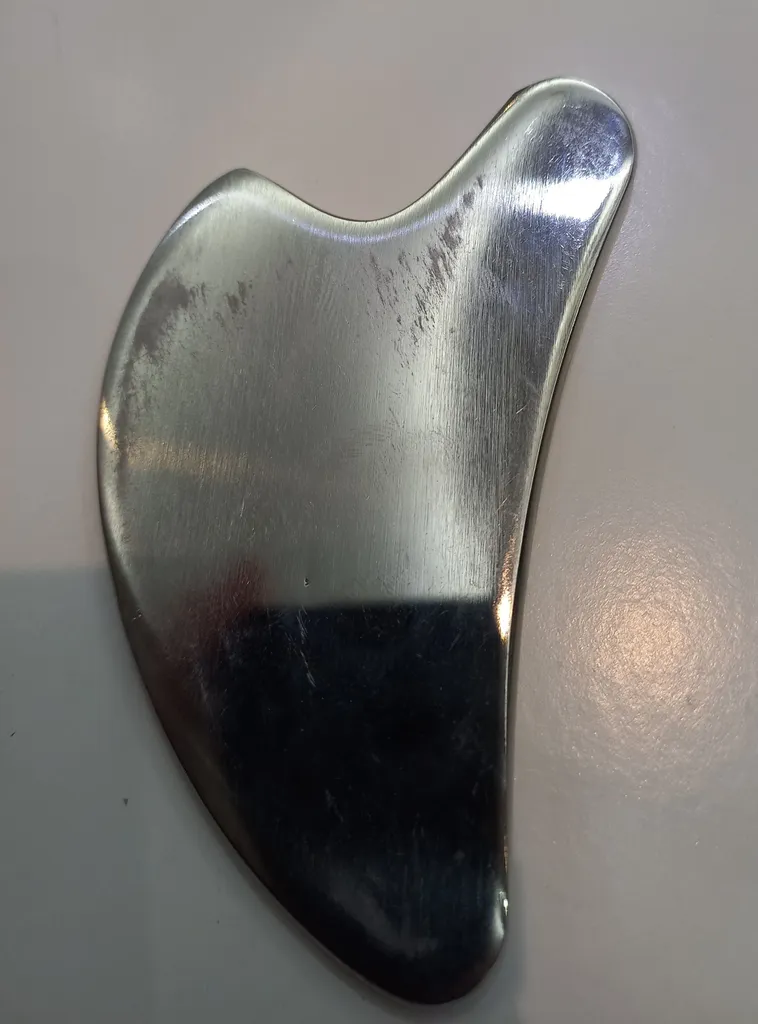 ماساژور دستی صورت مدل گوآشا استیل