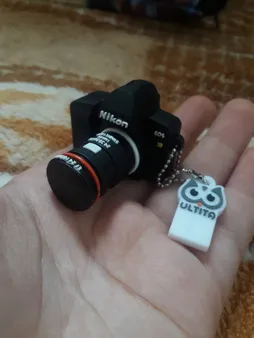 فلش مموری طرح دوربین عکاسی نیکون مدل Ul-CN02 ظرفیت 32 گیگابایت