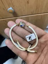 تجریه خرید دستبند طلا 18 عیار زنانه ناریا مدل پروانه و سنگ کد 02