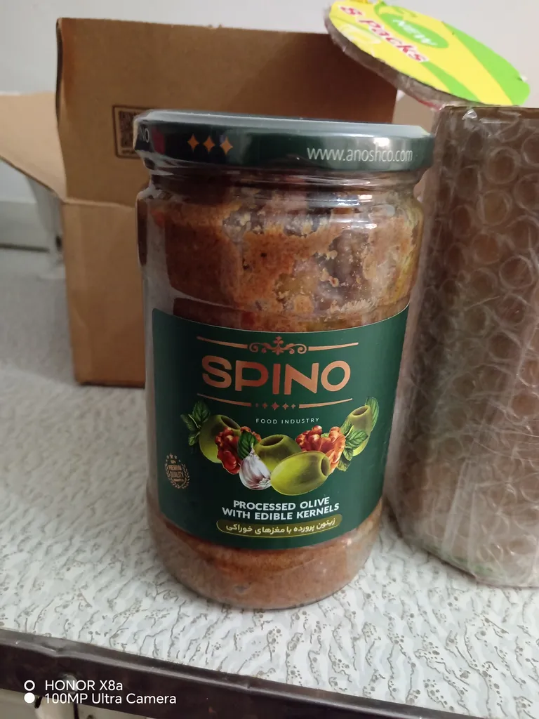 زیتون پرورده با مغزهای خوراکی اسپینو - 680 گرم