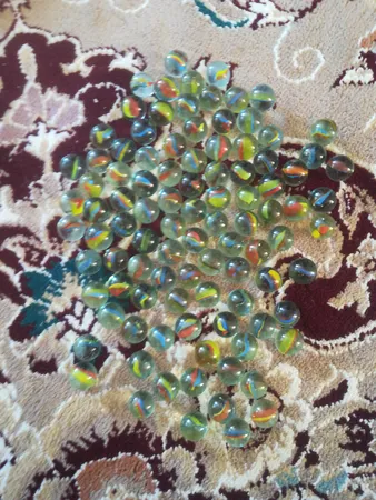 تیله شیشه ای مداد چوبی مدل چند پر بسته 100 عددی