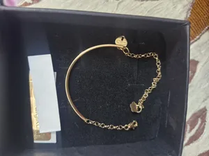 تجریه خرید دستبند زنجیری طلا 18 عیار زنانه الی گالری مدل پروفیل رولو ظریف قلب تیفانی تخت