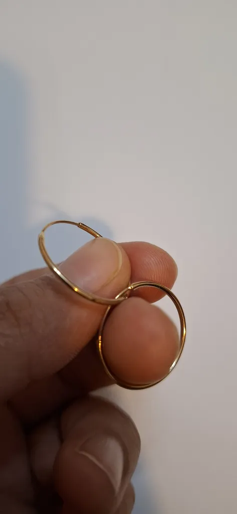 گوشواره طلا کم اجرت 18 عیار زنانه نوا گلد مدل حلقه ای گرد ساده 01