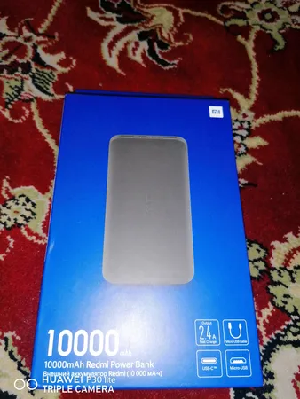 پاوربانک 10 وات شیائومی مدل Redmi ظرفیت 10000 میلی آمپر ساعت به همراه کابل تبدیل microUSB