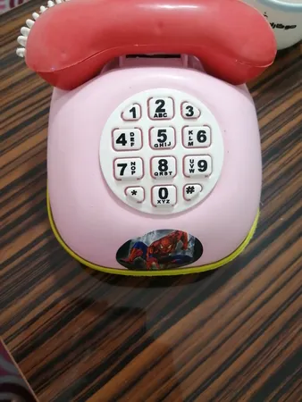 قلک طرح اسباب بازی تلفن و ماشین