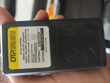 آداپتور 12 ولت 2 آمپر دی ای پی مدل dk1203_shenzhen