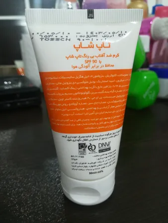 کرم ضدآفتاب بی‌رنگ تاپ شاپ مدل SPF90 مناسب انواع پوست، حجم 50 میلی‌لیتر