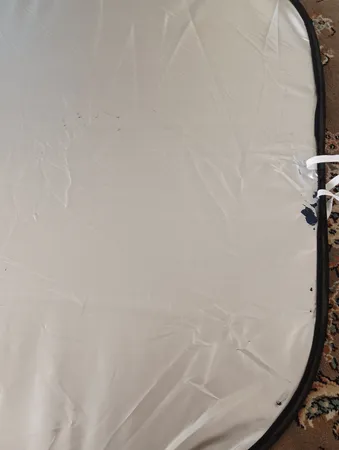 آفتابگیر شیشه جلو خودرو مدل عینکی به همراه کاور نگهدارنده