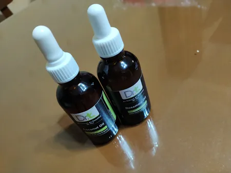 روغن مو دکترتی مدل رزماری حجم 50 میلی لیتر به همراه روغن مو دکترتی مدل نارگیل حجم 50 میلی لیتر