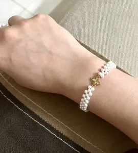 تجریه خرید دستبند طلا 18 عیار زنانه با بند مهره‌ای ناریا مدل مروارید- چهار پر