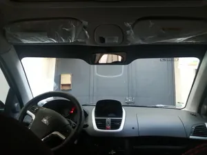 تجریه خرید برچسب آفتابگیر شیشه جلو آرسی زد اسپرت مدل Wings207206 مناسب برای پژو 206 و 207