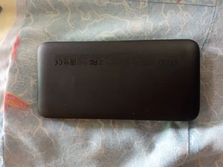 پاوربانک 10 وات شیائومی مدل Redmi ظرفیت 10000 میلی آمپر ساعت به همراه کابل تبدیل microUSB