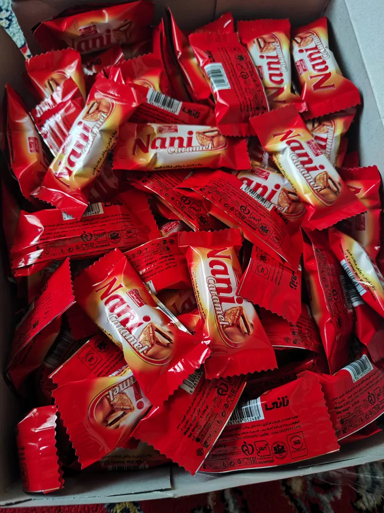 شکلات مغز دار نانی شیرین عسل -800 گرم بسته 100 عددی