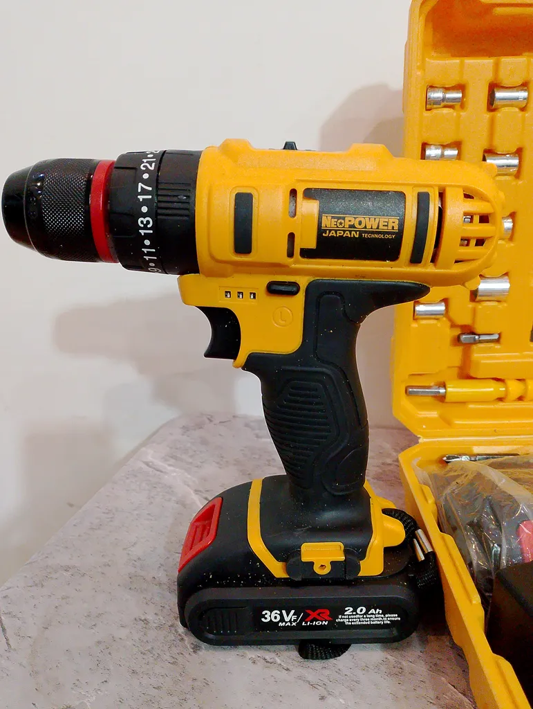 دریل پیچ گوشتی شارژی چکشی نیو پاور مدل 36-2 مجموعه 25 عددی