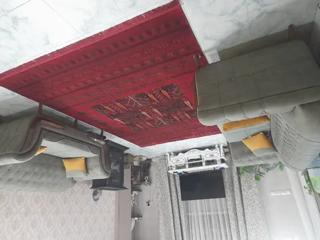 فرش ماشینی هیوا طرح بلوچ کد 3-219 زمینه لاکی