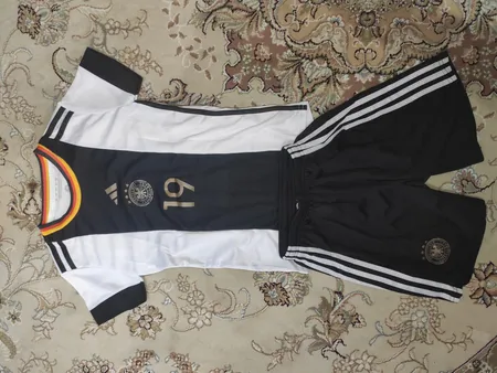 ست پیراهن و شوت ورزشی پسرانه مدل جام جهانی 2022 طرح آلمان