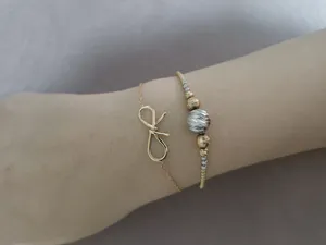 تجریه خرید دستبند طلا 18 عیار زنانه ماوی گالری مدل پاپیون مفتولی ساده