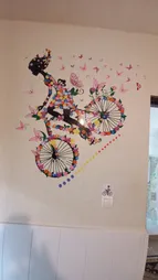 استیکر دیواری ژیوار طرح دختر دوچرخه سوار