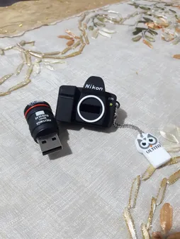 فلش مموری طرح دوربین عکاسی نیکون مدل Ul-CN02 ظرفیت 32 گیگابایت