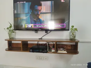 تجریه خرید میز تلویزیون دیواری مدل  DLF83L