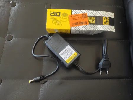 آداپتور 12 ولت 2 آمپر دی ای پی مدل dk1203_shenzhen