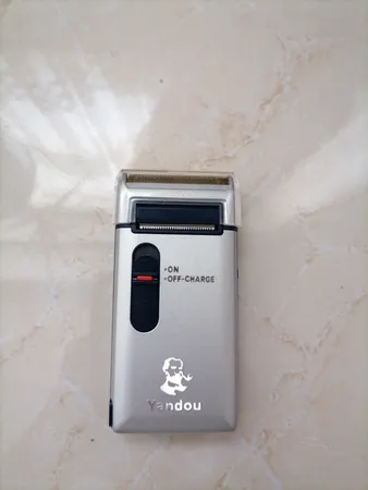 ماشین اصلاح موی صورت یاندو مدل Sv-w301u به همراه تیغه و توری یدک