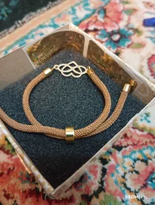 تجریه خرید دستبند طلا 18 عیار زنانه مدل قلب و بی نهايت